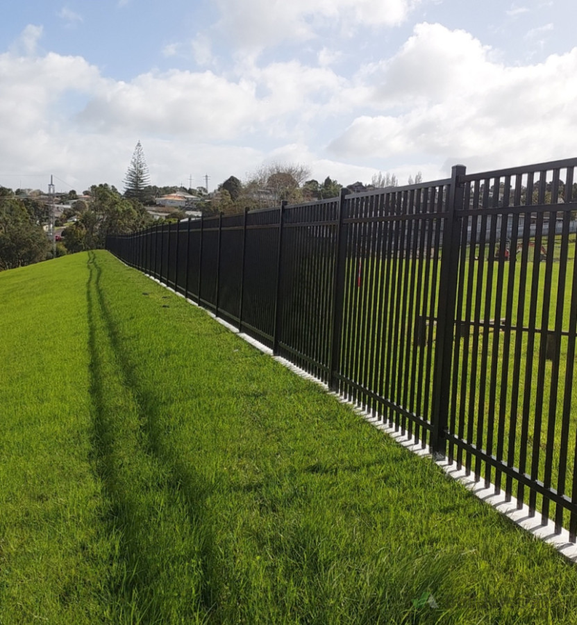 1.8 high Aliminium with concrete mow strip installed for Glenfield primary school.
