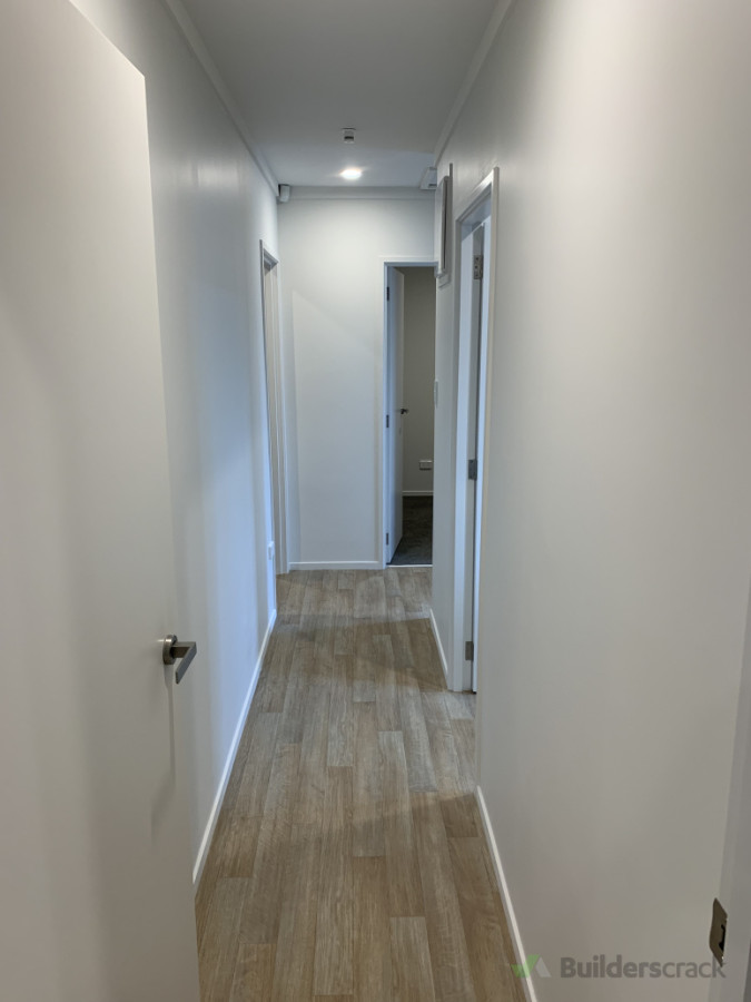 Hallway to bathroom, laundry, & bedrooms