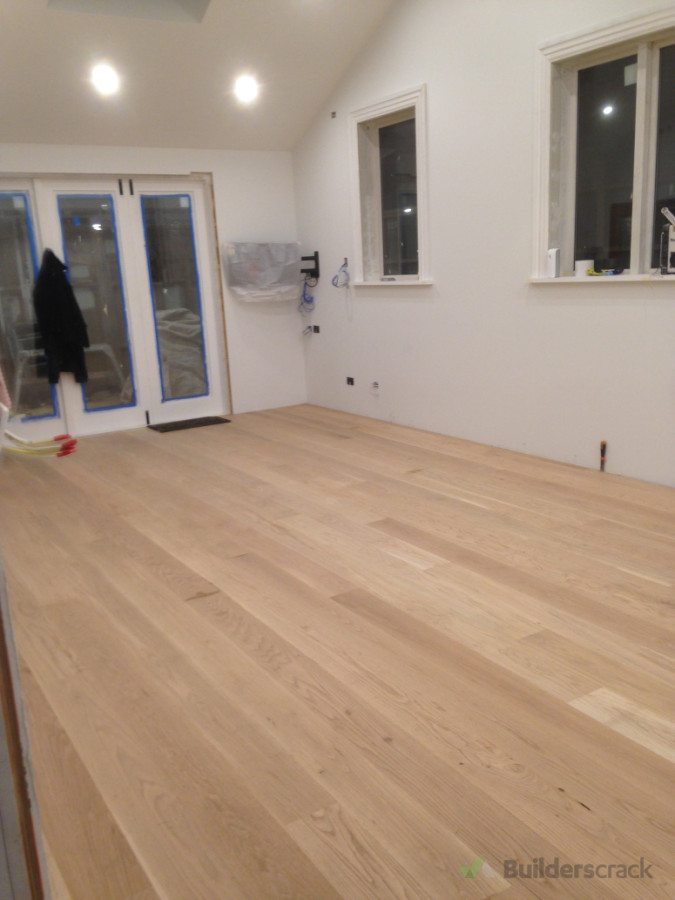 American Oak flooring installation through kitchen/living room