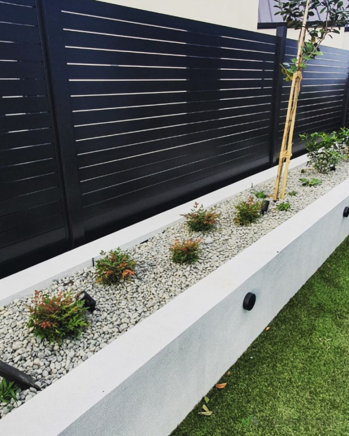 Slatted Horizontal Aluminium fence with a Concrete Block wall