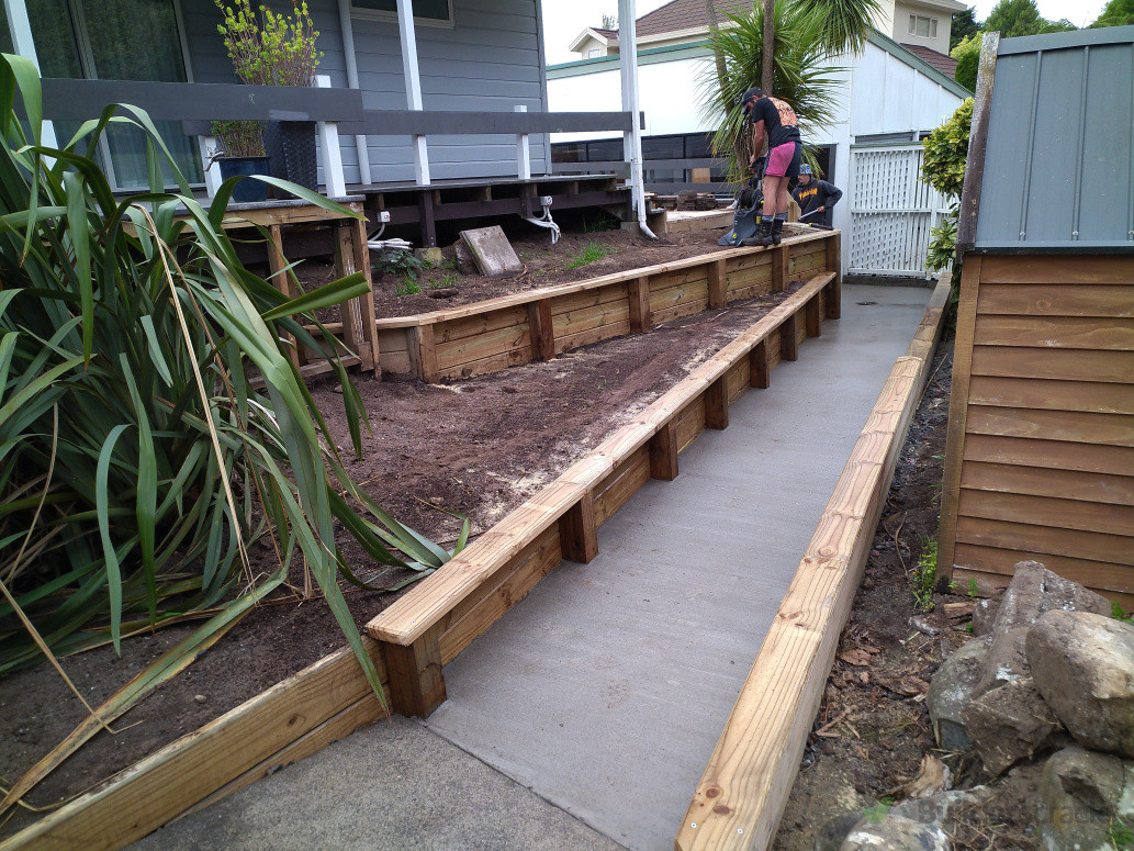 Small retaining walls and new concrete path