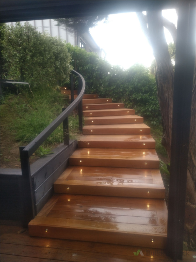 Installing deck lights on curved stairs looks great .