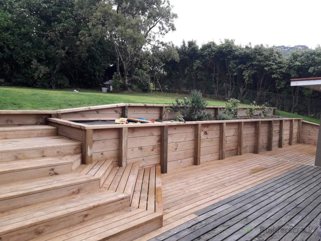 Deck extension, steps,  retaining wall and farden beds.