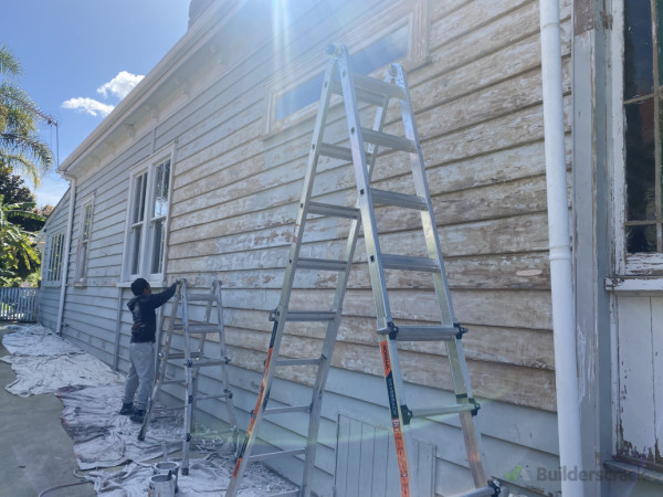 Scraping and sanding weatherboard Exterior painting