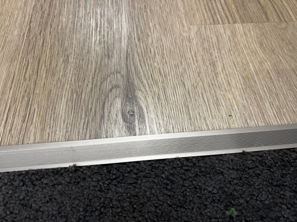 Existing carpet meets new flooring