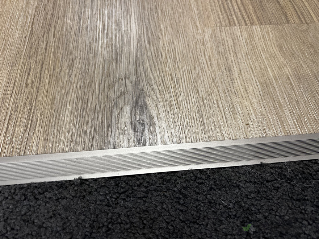 Existing carpet meets new flooring