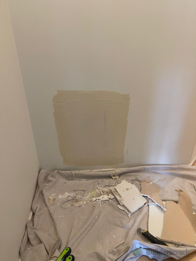 The initial coat of plastering.