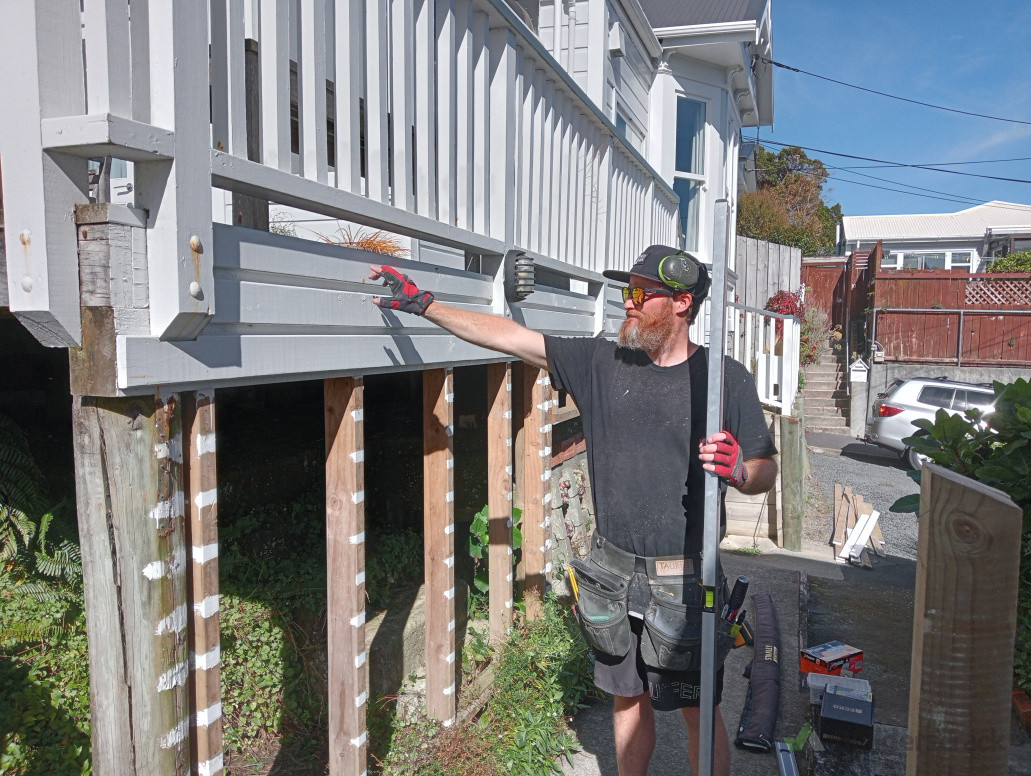 Removal of existing decking, sanded to remove paint