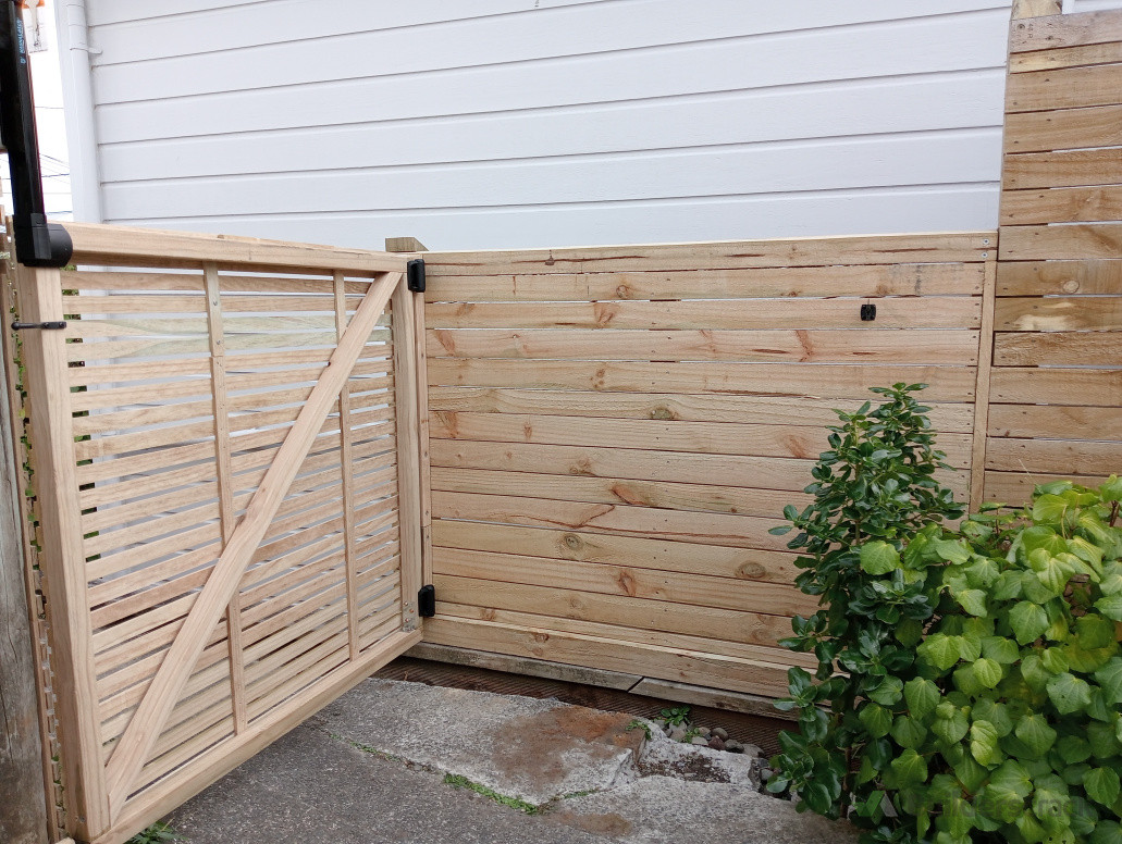 Addition to existing fence, built new gate