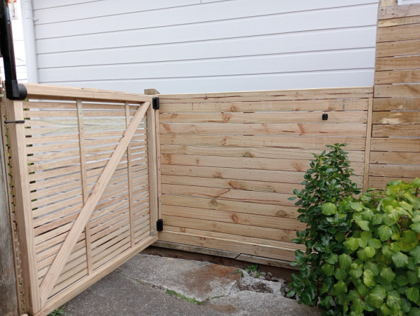 Addition to existing fencing, built new gate to match
