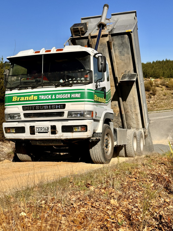 Spreading gravel for new driveway