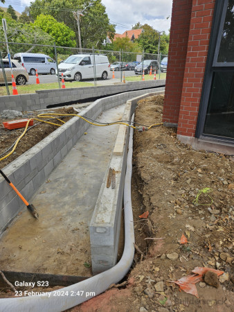 Concrete laid for overflow path