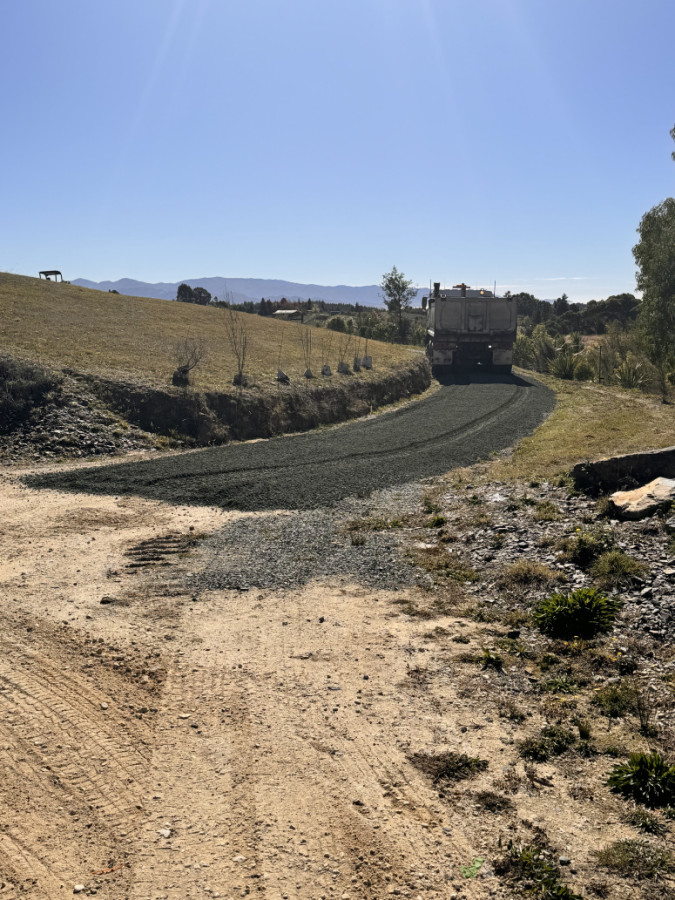 Spreading gravel for driveway