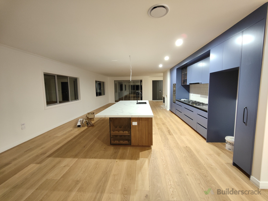 modern kitchen and living room with big bench top