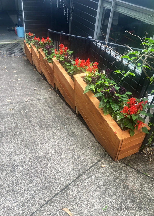 Terraced planter box job completed with drainage channel underneath for east maintenance.