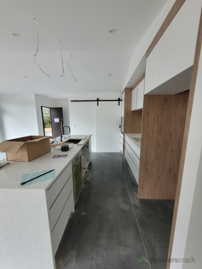 New modern kitchen with scullary behind barn style door