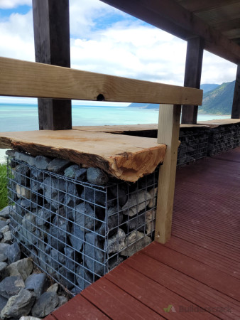 Live edge Macrocarpa leaders built onto gabian baskets filled with local river rocks