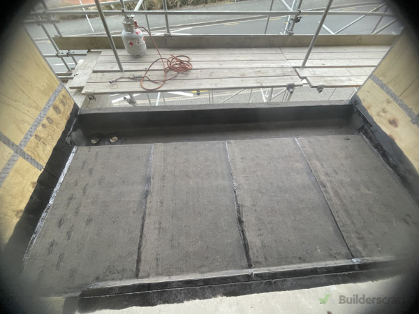 Vented base sheet installed over concrete substrate