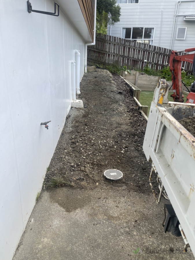 Cesspit at the lowest point of retaining wall