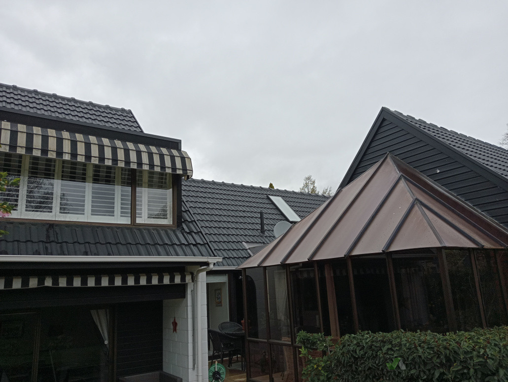 Concrete Tile Roof Painted Black to Uplift and Modernize