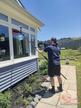 Jamie cleaning exterior windows