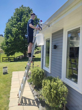Sam cleaning gutters