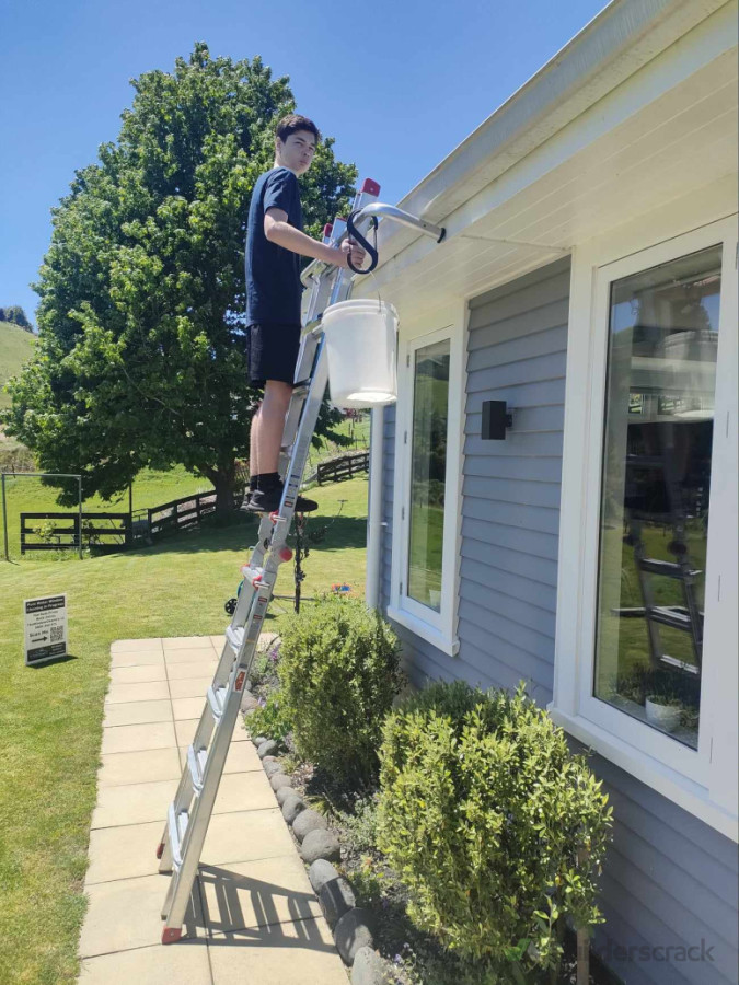 Sam cleaning gutters