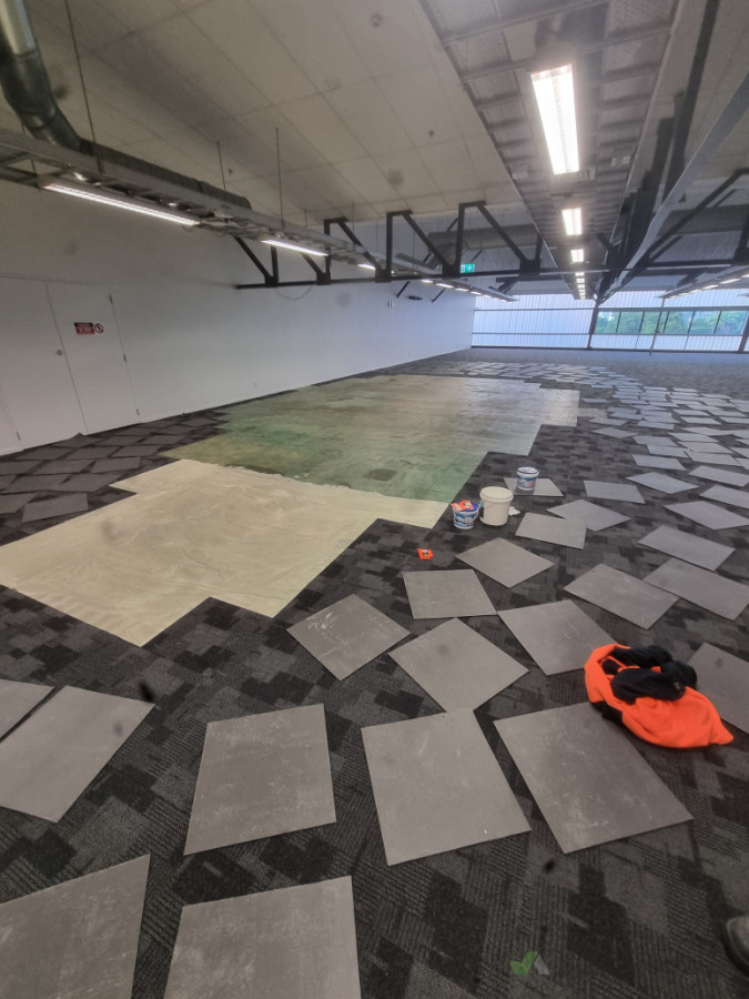 Carpet tile repairs from flood damages