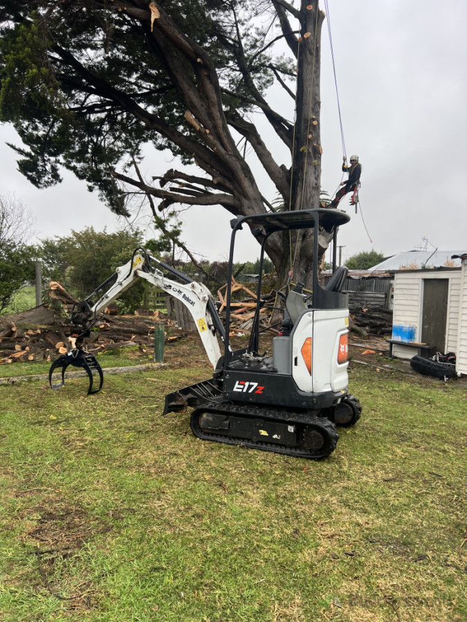 Our grapple is very handy for feeding larger branches into chippers