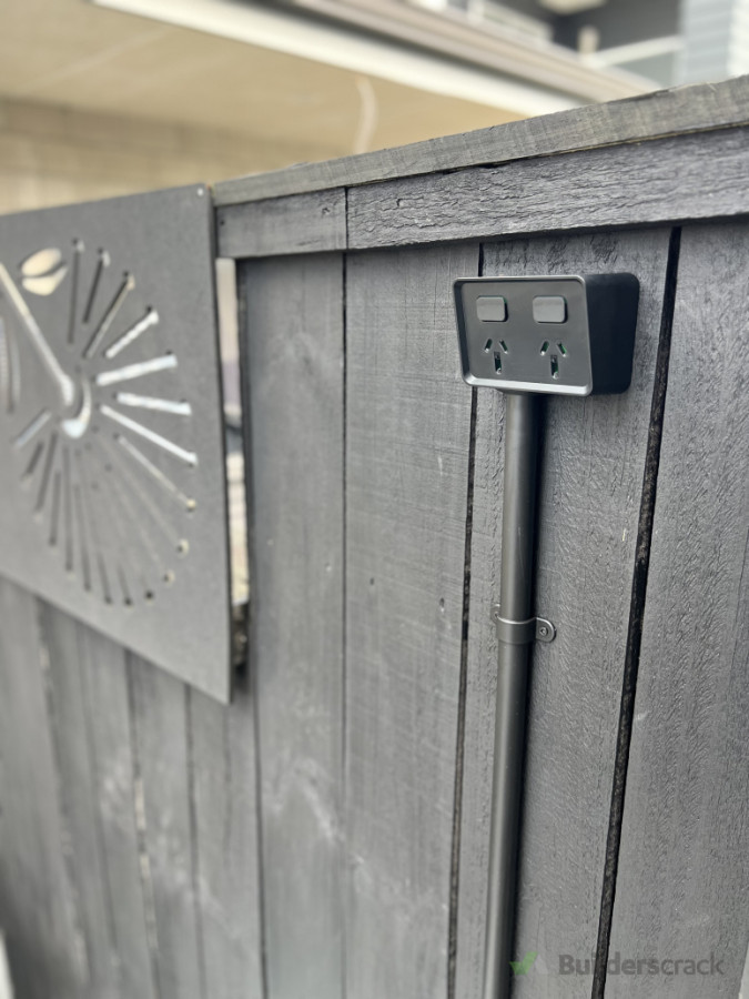 Weatherproof double socket in black to blend in with its surroundings