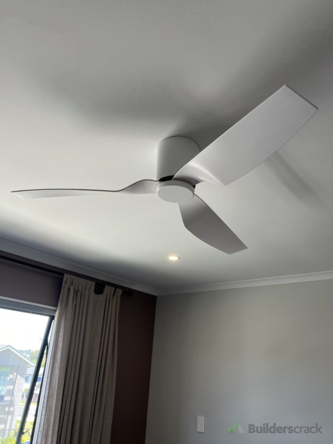 Fan installed above bed during summer to combat the heat