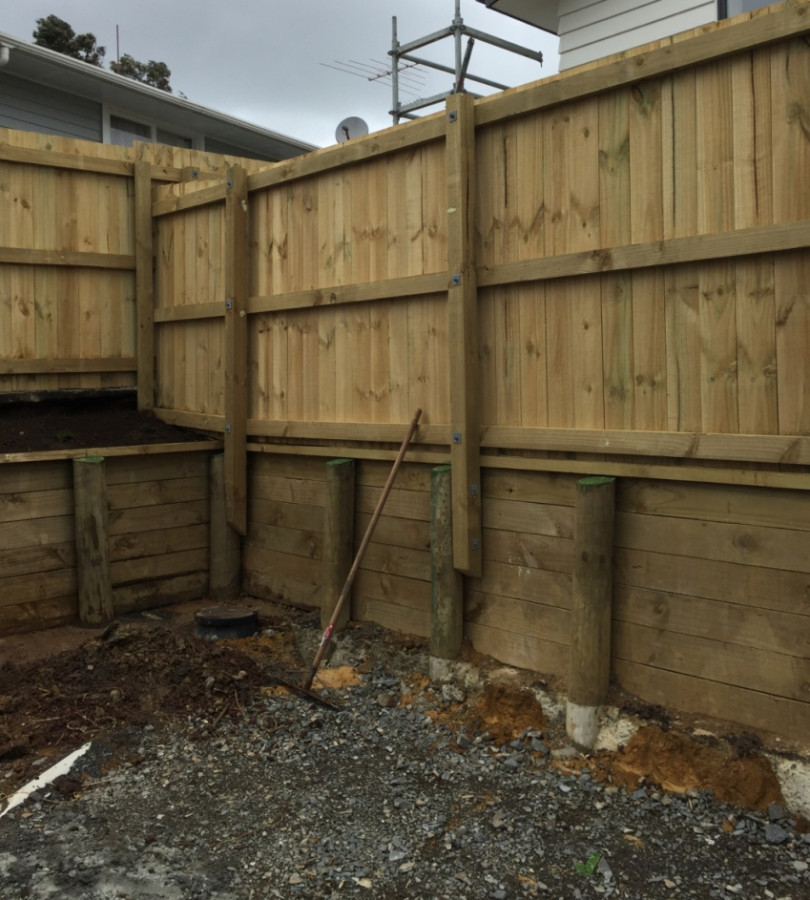 Group housing retaining wall and fencing to support the load of surcharge from higher dwelling and offer privacy between tenants
