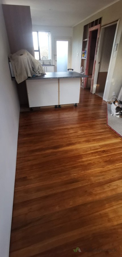 Looking from the dining room into the kitchen