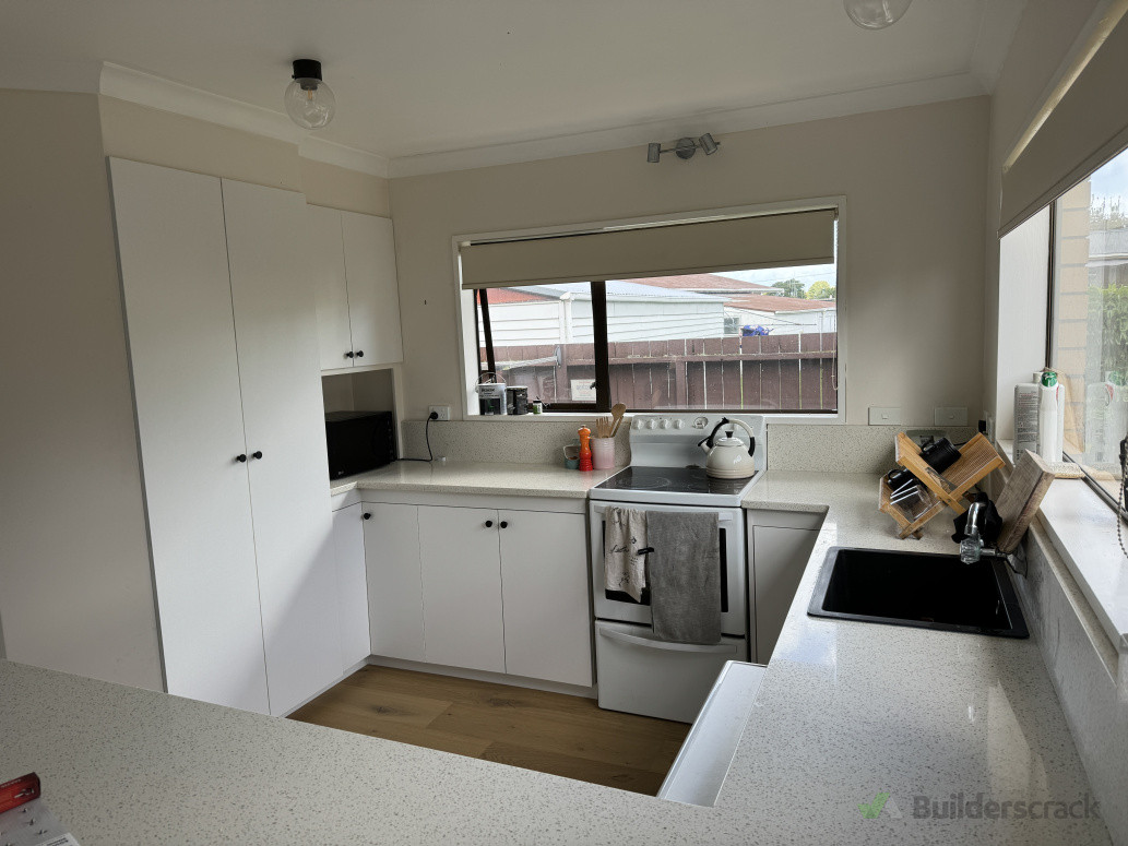 Convert old kitchen cabinets to new, new sink installed and flooring.