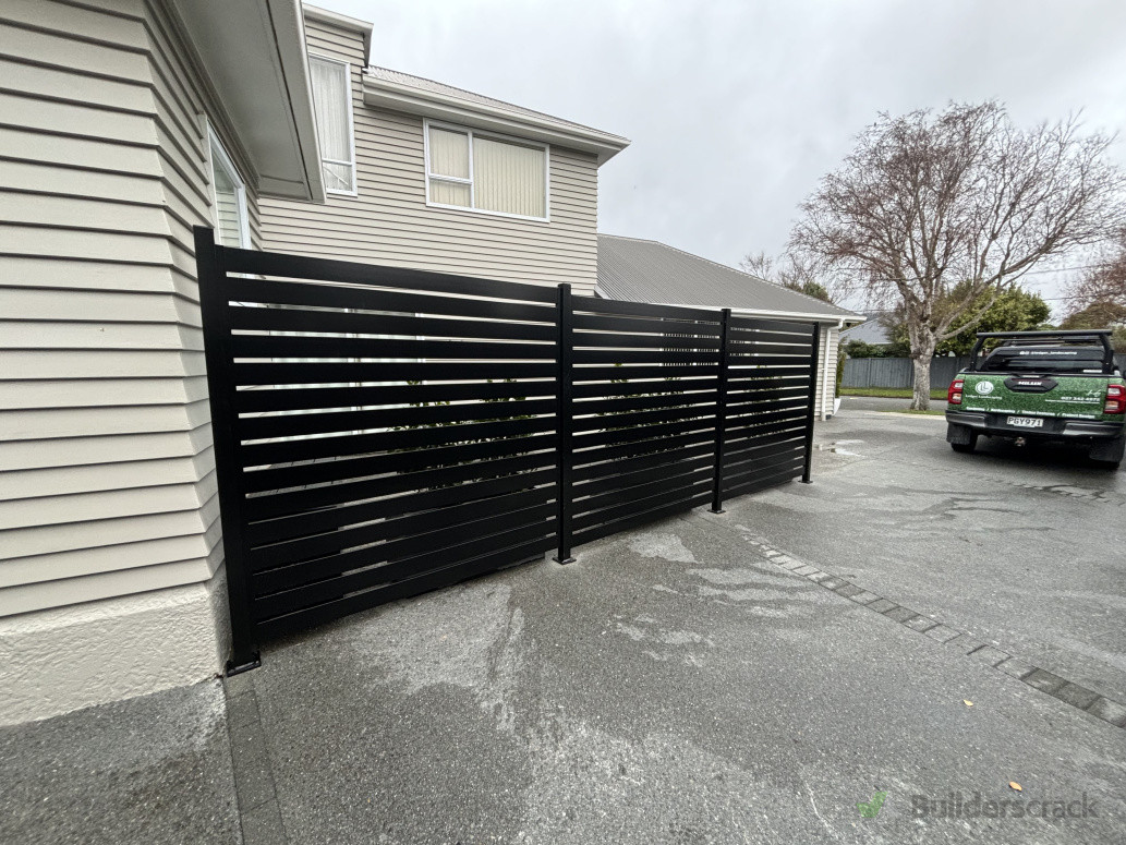 Metal slat fence