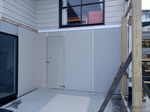 After - new framing and cladding installed, new door created