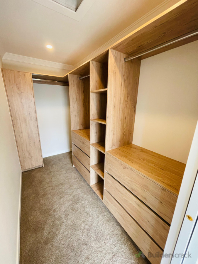 Wooden color walk in wardrobe