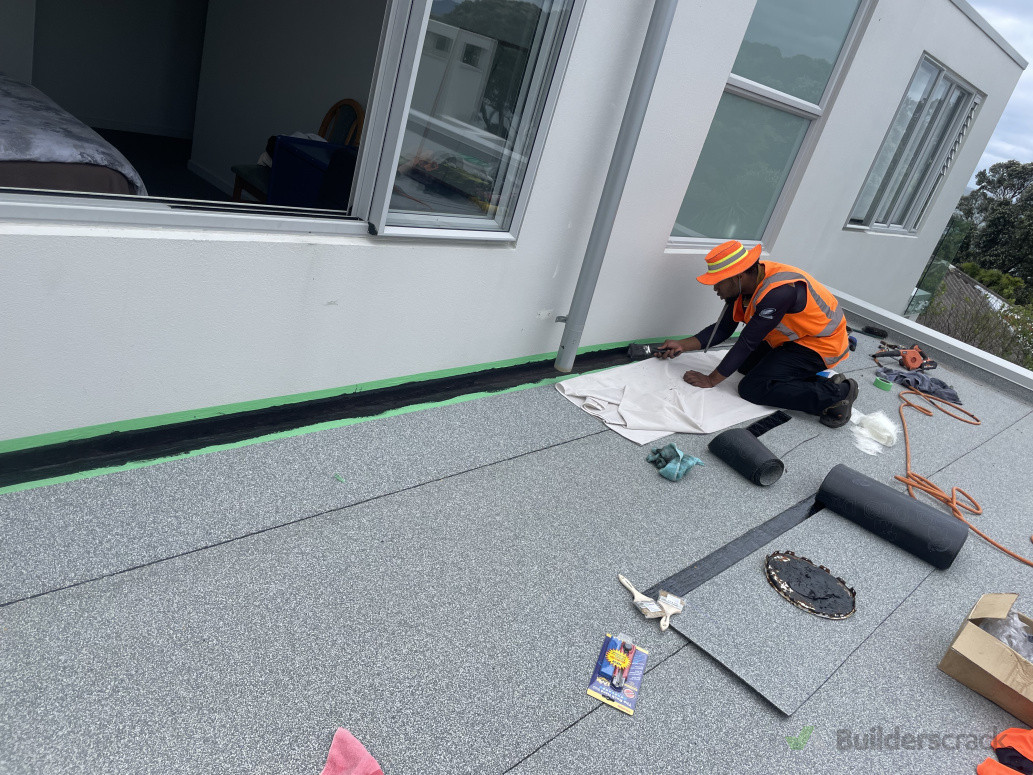 Cost savings solution instead of removing cladding we opted for easyflash liquid membrane termination and used Grey/white mineral chip to be sprinkled over final coat of easyflash to allow for a uniform finish.