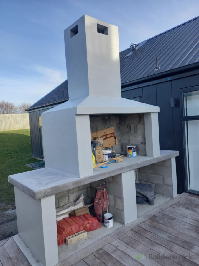After the paint and the finished product of the outdoor chimney/fireplace