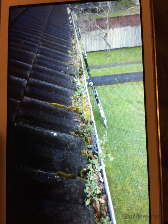 Blocked gutter due to heavy debris