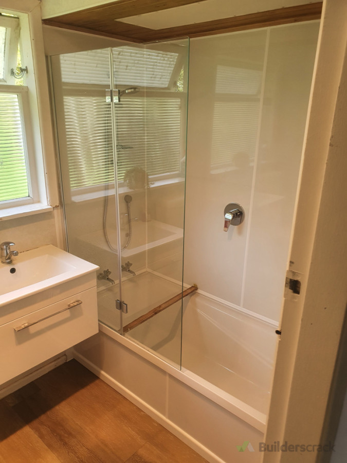 Shower Over Bath. Seratone Wall Linings & Wall Hung Vanity.