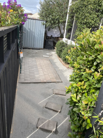 My client had some cobbles with I was able to relay under the washing line and a few steps . Levelled the rest of the area for artificial grass