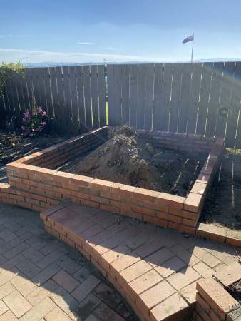 This client bought this house and found some left over bricks that I was able to use to build a nice planter