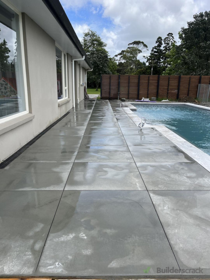 Cloudy Bay concrete cut into tiles around the pool