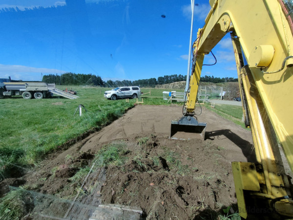 Dig out top soil and remove