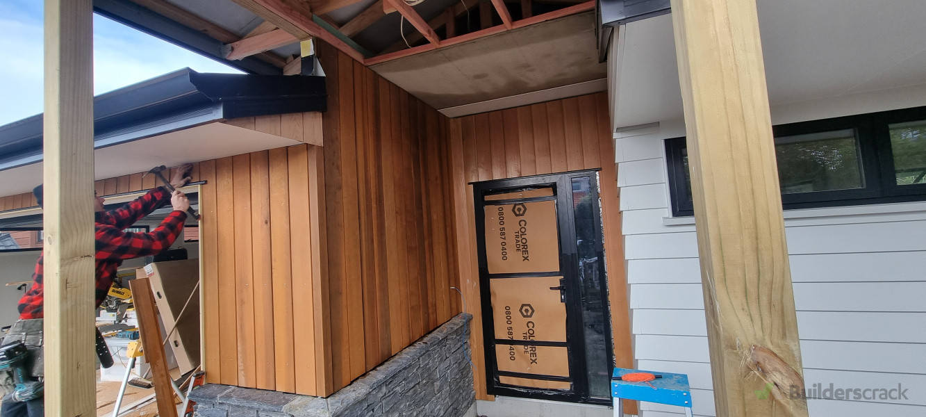 Cedar cladding , to entrance of a new build