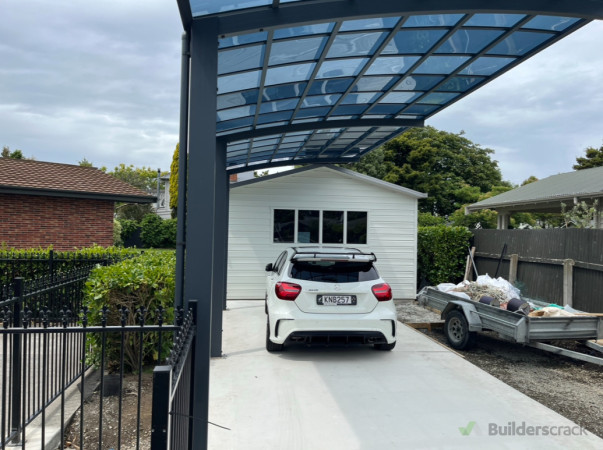 Finished Carport Installation: Completed  carport installation featuring a sleek, modern design with durable materials, providing effective protection for vehicles while enhancing the property's curb appeal.