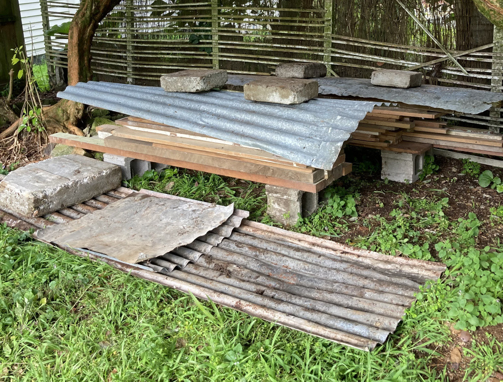 All timber sorted and stacked along with iron.  All rubbish removed from property.