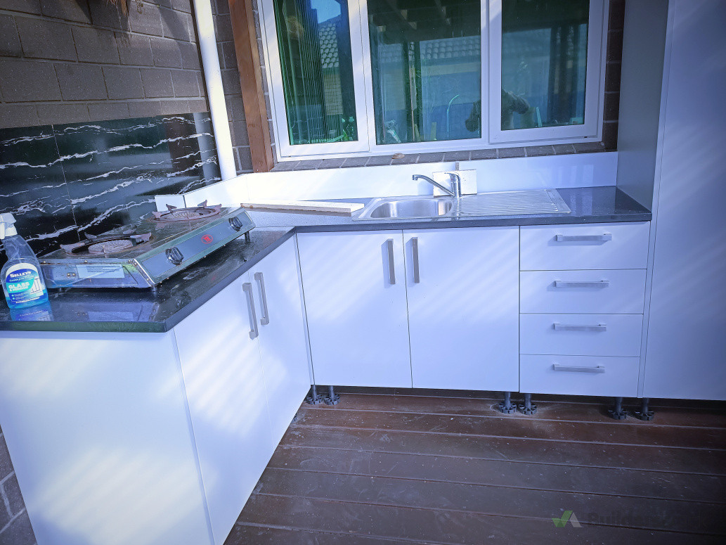 Kitchen replacement with granite top + spice rack.