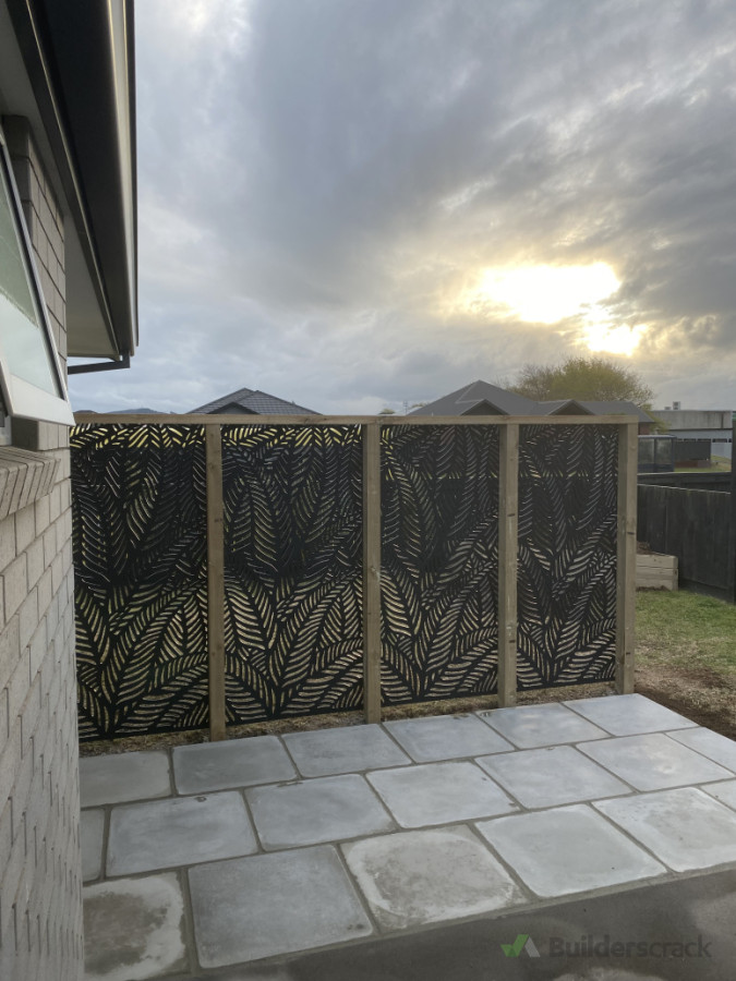 Extended patio with second hand pavers that the client sourced. Also installed a cost effective screen for some privacy.